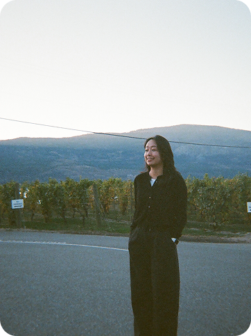Mikael standing in a vineyard landscape